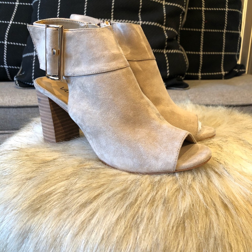 Suede heels with gold buckle.